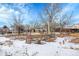 Backyard with wooden fence and snow cover at 7111 Monaco St, Commerce City, CO 80022