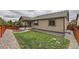 Attractive backyard with lush lawn, perimeter gravel, and a charming exterior view of the home at 7442 Greenwater Cir, Castle Rock, CO 80108