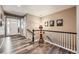 Inviting entryway with hardwood floors, neutral walls, and staircase leading to a second floor at 7442 Greenwater Cir, Castle Rock, CO 80108