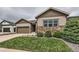 Charming two-story home with stone accents, a two-car garage, and meticulously maintained landscaping at 7442 Greenwater Cir, Castle Rock, CO 80108