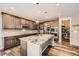 Beautiful kitchen with large island, stainless steel appliances, and granite countertops, also featuring a walk in pantry at 7442 Greenwater Cir, Castle Rock, CO 80108