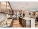 Modern kitchen with stainless steel appliances, granite countertops, and a spacious island at 7442 Greenwater Cir, Castle Rock, CO 80108