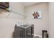 Laundry area featuring modern, matching washer and dryer set, complemented by a minimalist design at 7442 Greenwater Cir, Castle Rock, CO 80108
