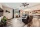 Spacious living room with hardwood floors, a ceiling fan, and modern decor at 7442 Greenwater Cir, Castle Rock, CO 80108
