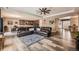 Expansive living area with hardwood floors, comfortable seating, and seamless flow to the kitchen at 7442 Greenwater Cir, Castle Rock, CO 80108