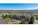 A picturesque townhome community with beautiful landscaping and stunning views of the mountains and city skyline at 835 Stony Mesa Pl, Castle Rock, CO 80108