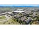An aerial shot showcases a well-planned neighborhood, complete with retail nearby, blending suburban tranquility and urban convenience at 835 Stony Mesa Pl, Castle Rock, CO 80108