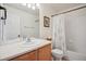 Clean bathroom features a shower with curtain and a large mirror at 835 Stony Mesa Pl, Castle Rock, CO 80108