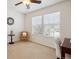 Well lit bedroom with a ceiling fan, and large windows at 835 Stony Mesa Pl, Castle Rock, CO 80108