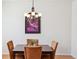 Elegant dining room showcasing a refined chandelier and a captivating art piece at 835 Stony Mesa Pl, Castle Rock, CO 80108