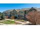 Attractive townhouse exterior with stone accents and well-maintained landscaping at 835 Stony Mesa Pl, Castle Rock, CO 80108