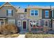 Charming townhouse exterior with a stone facade and covered porch at 835 Stony Mesa Pl, Castle Rock, CO 80108