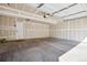 Spacious, unfinished garage with painted walls and concrete floor at 835 Stony Mesa Pl, Castle Rock, CO 80108