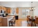 Bright eat-in kitchen boasts a breakfast bar, sleek black appliances, and ample cabinet space at 835 Stony Mesa Pl, Castle Rock, CO 80108