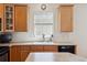 Light and airy kitchen with a window over the sink and ample counter space at 835 Stony Mesa Pl, Castle Rock, CO 80108
