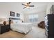 Serene bedroom with plush carpet, a ceiling fan, and plenty of natural light at 835 Stony Mesa Pl, Castle Rock, CO 80108