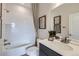 Bright bathroom featuring a shower-tub combo with white subway tile and a modern vanity with decor at 4096 Estrella St, Brighton, CO 80601