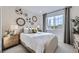 Stylish bedroom with a large window, decorative wall art, and comfortable furnishings at 4096 Estrella St, Brighton, CO 80601