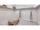 Organized walk-in closet with ample shelving, hanging storage, and comfortable bench at 4096 Estrella St, Brighton, CO 80601
