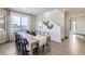 Bright dining area with a large window, stylish decor, and an inviting atmosphere for meals at 4096 Estrella St, Brighton, CO 80601