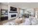 Open living space with a fireplace, dining area, and stylish decor for modern living at 4096 Estrella St, Brighton, CO 80601