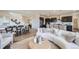 Open-concept living space featuring a modern kitchen, dining area, and a comfortable living room at 4096 Estrella St, Brighton, CO 80601