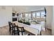 Bright, open-concept space with a dining table, cozy living area, and modern kitchen at 4096 Estrella St, Brighton, CO 80601