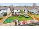 Aerial view of a large backyard with a deck, play area, trampoline and fire pit at 6565 W 99Th Ave, Broomfield, CO 80021