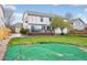 Expansive backyard featuring a deck, trampoline, and play area at 6565 W 99Th Ave, Broomfield, CO 80021