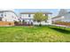 Large backyard featuring lush green grass, wood deck, and trampoline at 6565 W 99Th Ave, Broomfield, CO 80021