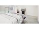 Spacious basement bedroom featuring a bed, mounted television, and bathroom access at 6565 W 99Th Ave, Broomfield, CO 80021
