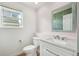 Stylish half bathroom with a modern vanity, mirror, and fresh, bright decor at 6565 W 99Th Ave, Broomfield, CO 80021