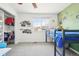 Bright bedroom featuring a window view, carpeted floor, and closet with hanging clothes at 6565 W 99Th Ave, Broomfield, CO 80021
