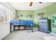 Bright bedroom featuring a window view, carpeted floor, and monster truck wall decor at 6565 W 99Th Ave, Broomfield, CO 80021