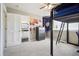 Cozy bedroom featuring a loft bed, carpeted floor, and access to an ensuite bathroom at 6565 W 99Th Ave, Broomfield, CO 80021