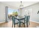 The dining room features backyard access through sliding glass doors, providing a perfect space to dine at 6565 W 99Th Ave, Broomfield, CO 80021