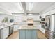 Bright kitchen features stainless steel appliances, granite countertops, a center island, and ample cabinet space at 6565 W 99Th Ave, Broomfield, CO 80021