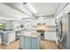 Bright kitchen features granite counters, stainless appliances and a convenient center island with breakfast bar at 6565 W 99Th Ave, Broomfield, CO 80021