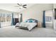 Spacious main bedroom with large windows, plush carpet, and ample closet space at 6565 W 99Th Ave, Broomfield, CO 80021