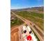 Panoramic aerial view showcasing the community with mountains and Bear Creek Lake Park nearby at 2225 S Poppy St, Lakewood, CO 80228