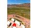 Aerial view of the neighborhood with nearby mountains and Red Rocks Amphitheater at 2225 S Poppy St, Lakewood, CO 80228