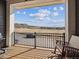 Charming balcony with a picturesque outdoor view, featuring rocking chairs and a grill at 2225 S Poppy St, Lakewood, CO 80228