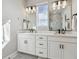 Bright bathroom with double vanity, modern fixtures, and ample counter space at 2225 S Poppy St, Lakewood, CO 80228