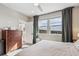 Sun-filled bedroom featuring a scenic view from large windows, complemented by tasteful furnishings at 2225 S Poppy St, Lakewood, CO 80228