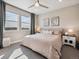 Bright bedroom with large windows, neutral decor, and a comfortable bed with stylish linens at 2225 S Poppy St, Lakewood, CO 80228