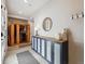 Welcoming entryway with cabinet, modern decor, and convenient coat hooks at 2225 S Poppy St, Lakewood, CO 80228