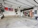 Spacious two car garage with storage racks and shelving providing ample room for parking and organization at 2225 S Poppy St, Lakewood, CO 80228