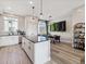 Inviting kitchen with an island, stainless appliances, and access to the dining area at 2225 S Poppy St, Lakewood, CO 80228