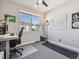 Bright office featuring a large window, modern desk and chair, and a peaceful workspace area at 2225 S Poppy St, Lakewood, CO 80228