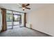 Bedroom with sliding door to balcony and ceiling fan at 1050 N Corona St # 207, Denver, CO 80218